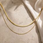 siknakit-zlata-dvojna-verizica-Herringbone-Duo-Gold-travertin-saten